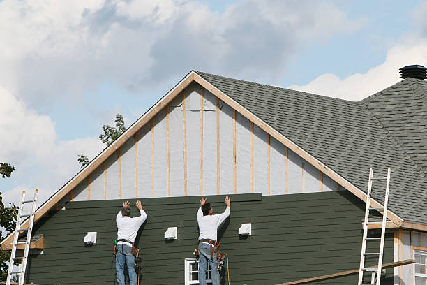 Professional Storm Damage Siding Repair technician working in Struthers, OH